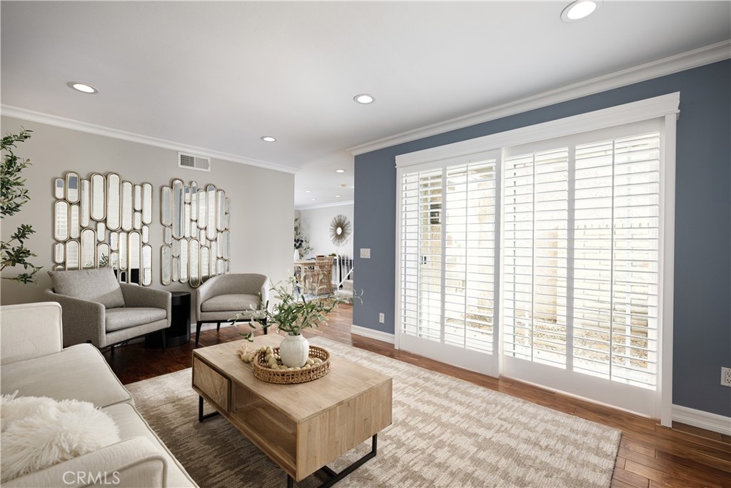 14241 Blackpool Road Westminster, CA 92683 - Photo 4 of 31 a living room with furniture and a large window