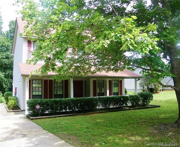 9301 Chislehurst Road Mint Hill, NC 28227 - Photo 2 of 9 a front view of a house with a yard and porch