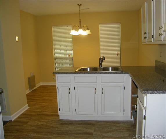 9301 Chislehurst Road Mint Hill, NC 28227 - Photo 4 of 9 a bathroom with a granite countertop sink and a mirror