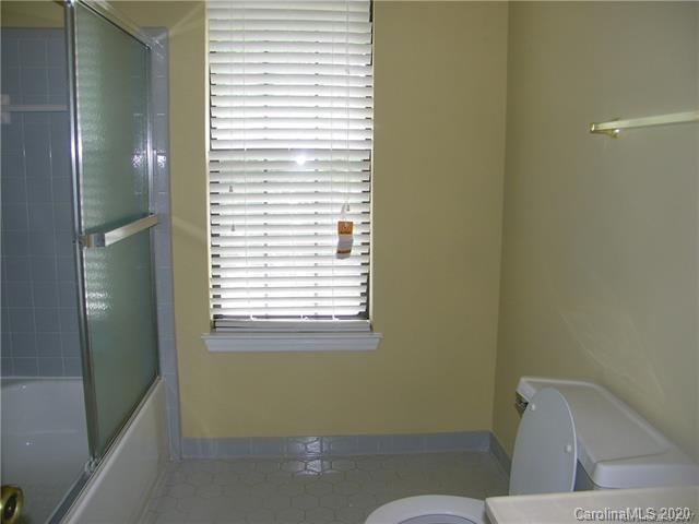 9301 Chislehurst Road Mint Hill, NC 28227 - Photo 8 of 9 a bathroom with a toilet and a sink
