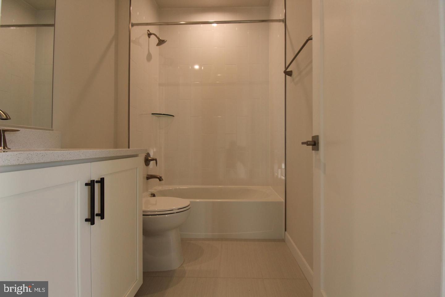 22383 Roanoke Rise Terrace Ashburn, VA 20148 - Photo 30 of 41 a bathroom with a granite countertop bathtub shower sink vanity and toilet