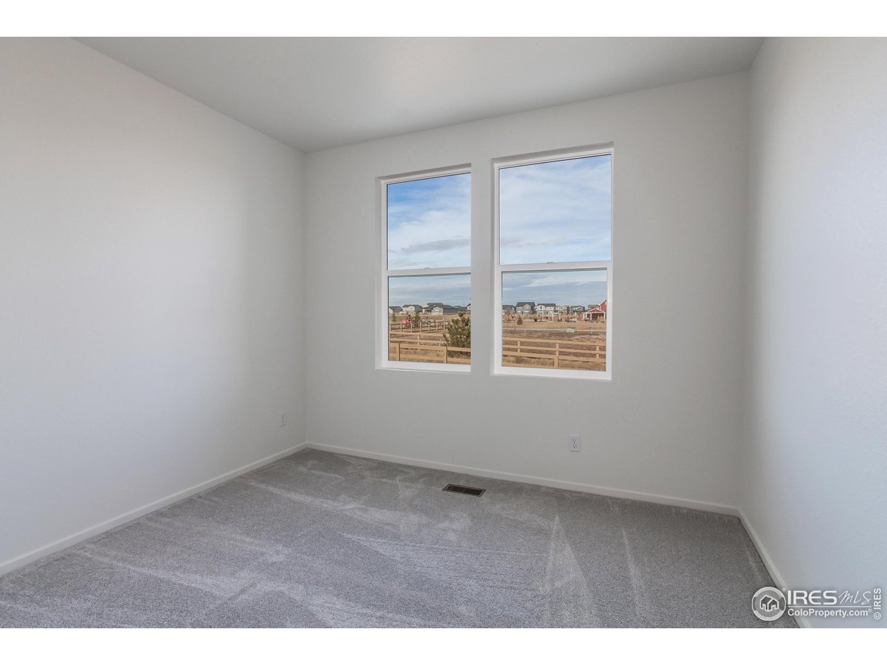 768 Chatter Road Windsor, CO 80550 - Photo 15 of 37 a view of an empty room with a window