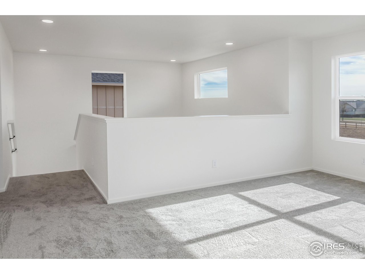 768 Chatter Road Windsor, CO 80550 - Photo 19 of 37 an empty room with windows