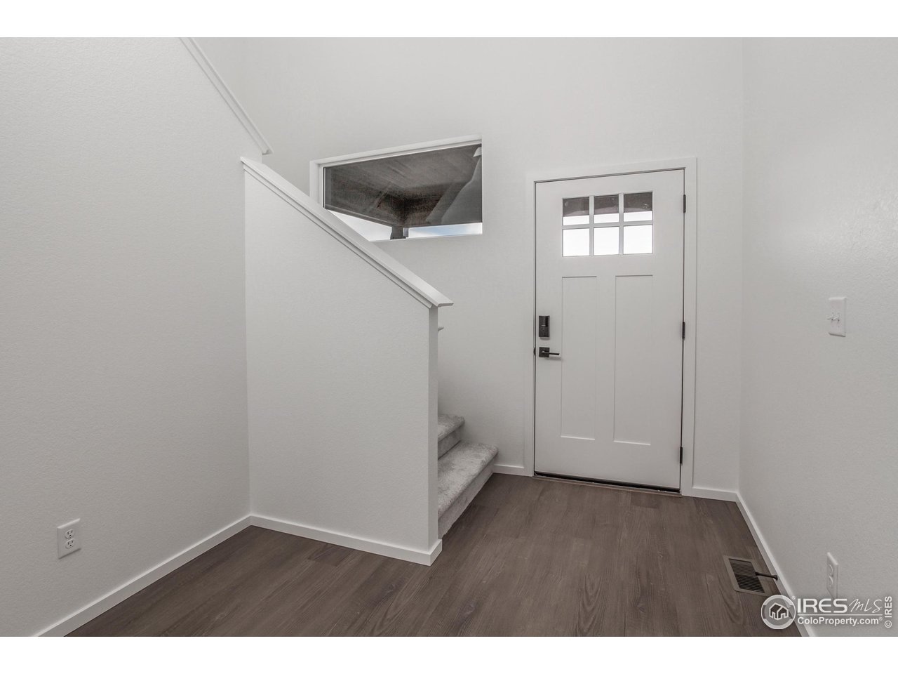 768 Chatter Road Windsor, CO 80550 - Photo 2 of 37 an empty room with windows and closet