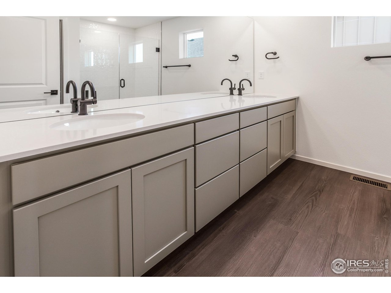 768 Chatter Road Windsor, CO 80550 - Photo 22 of 37 a bathroom with a double vanity sink and mirror