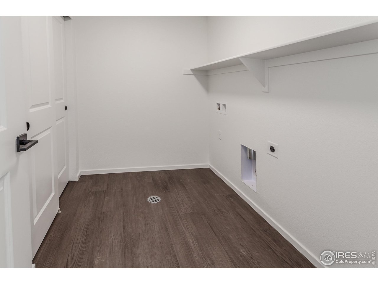 768 Chatter Road Windsor, CO 80550 - Photo 25 of 37 a view of a room with wooden floor