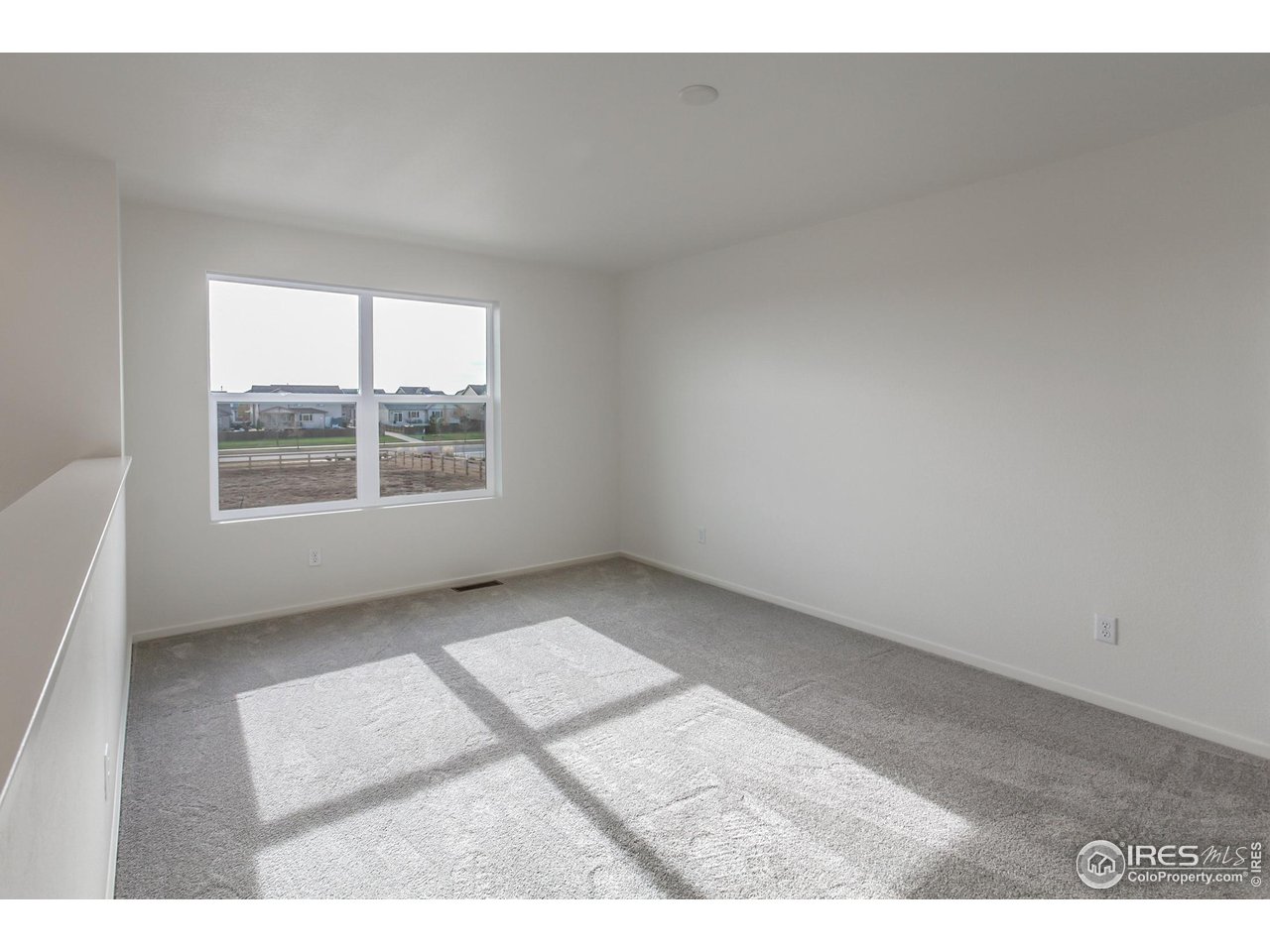 768 Chatter Road Windsor, CO 80550 - Photo 26 of 37 an empty room with windows
