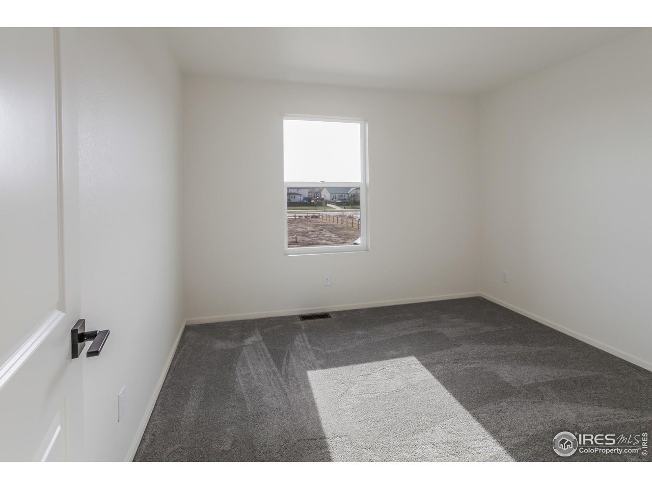 768 Chatter Road Windsor, CO 80550 - Photo 27 of 37 a view of an empty room and a window
