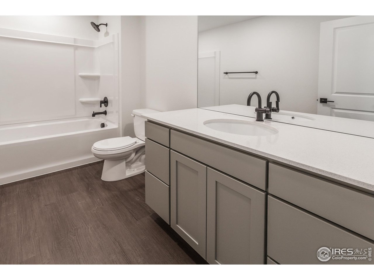 768 Chatter Road Windsor, CO 80550 - Photo 29 of 37 a bathroom with a sink a toilet and shower