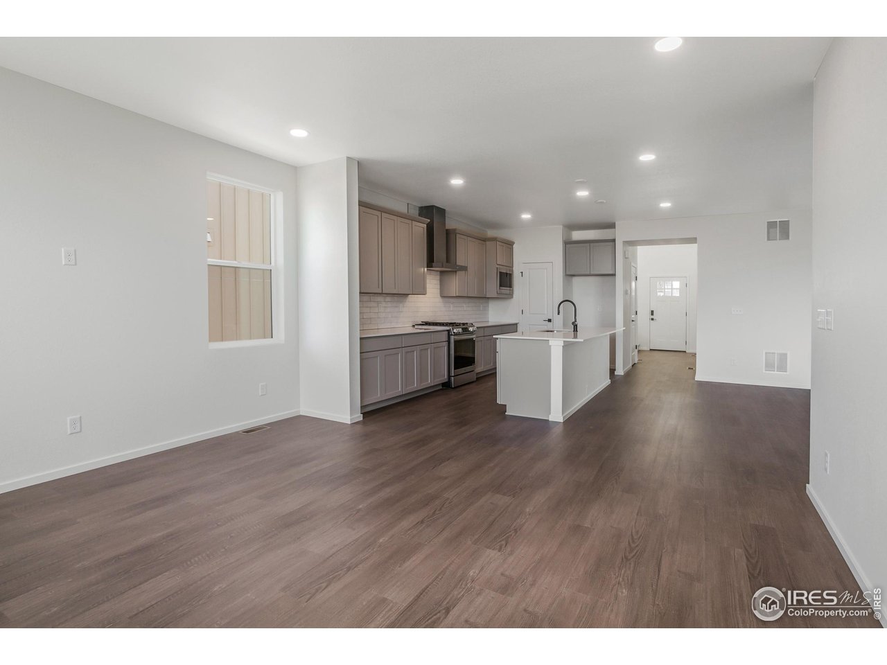768 Chatter Road Windsor, CO 80550 - Photo 5 of 37 a view of a kitchen with a sink and cabinets