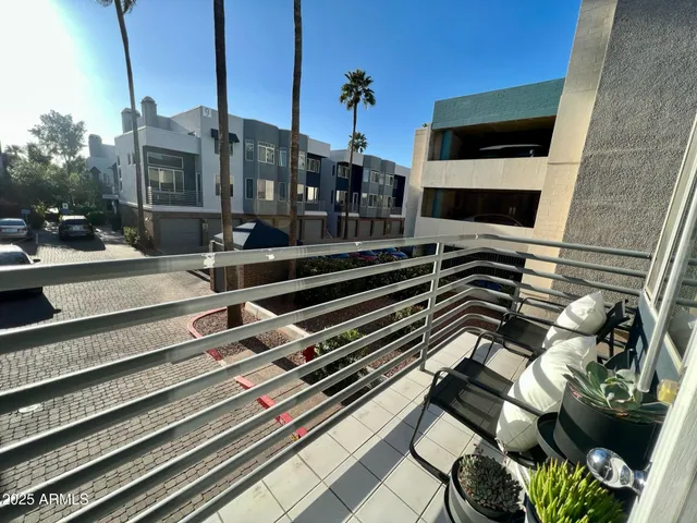 a living room with furniture and a book shelf