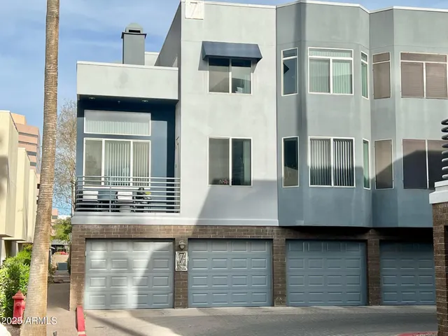 a view of the front of house with a patio