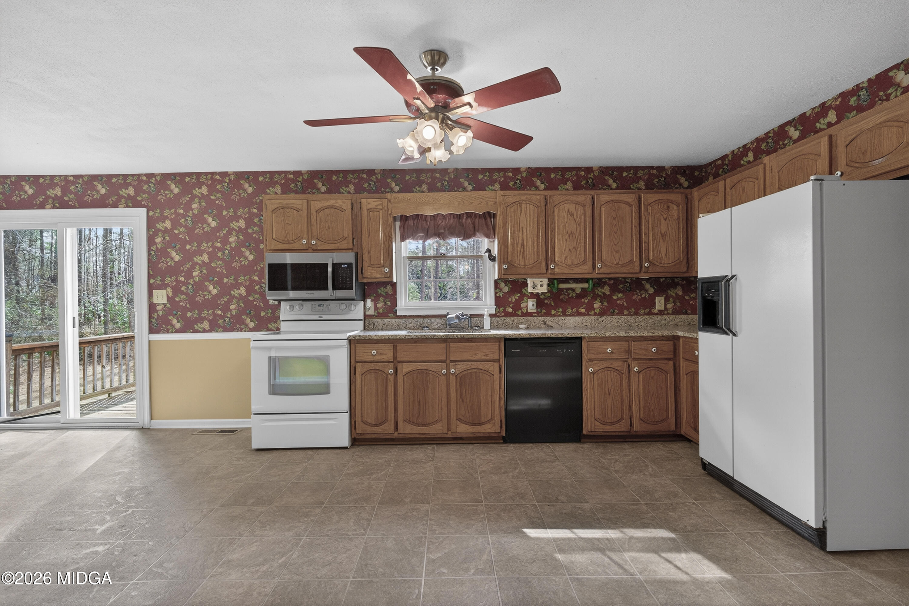337 Highway 18 Gray, GA 31032 - Photo 17 of 50 a kitchen with a refrigerator a stove top oven and a dishwasher