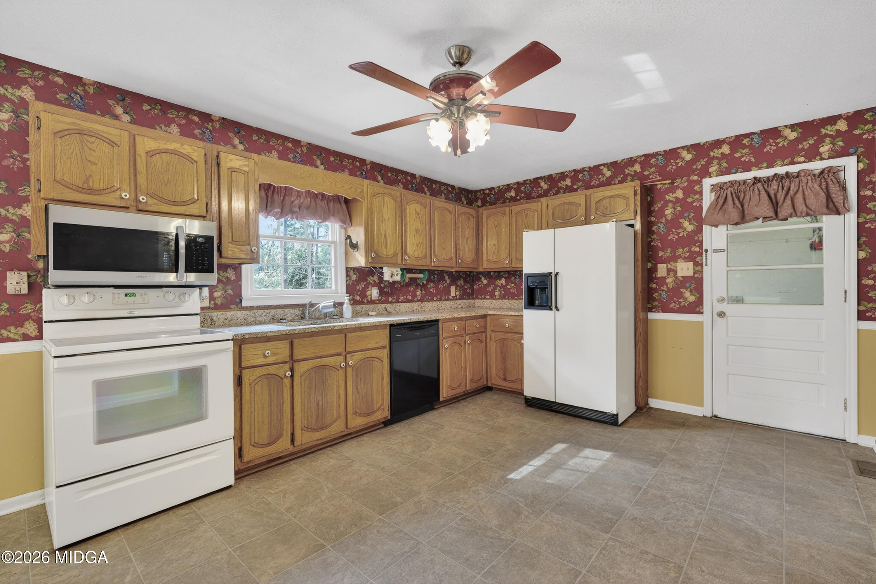337 Highway 18 Gray, GA 31032 - Photo 19 of 50 a kitchen with appliances cabinets and a sink