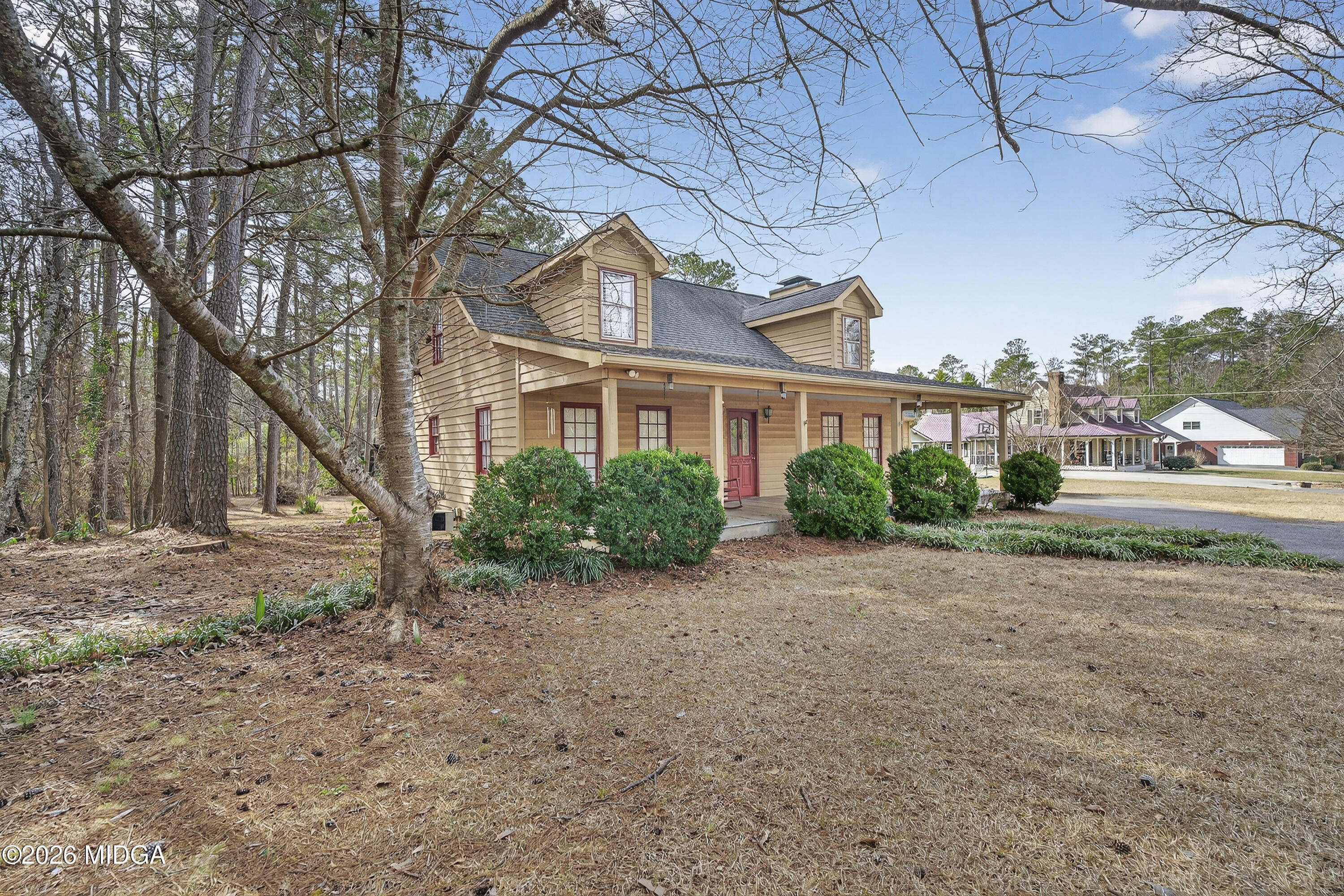337 Highway 18 Gray, GA 31032 - Photo 3 of 50 a front view of a house with a yard and potted plants