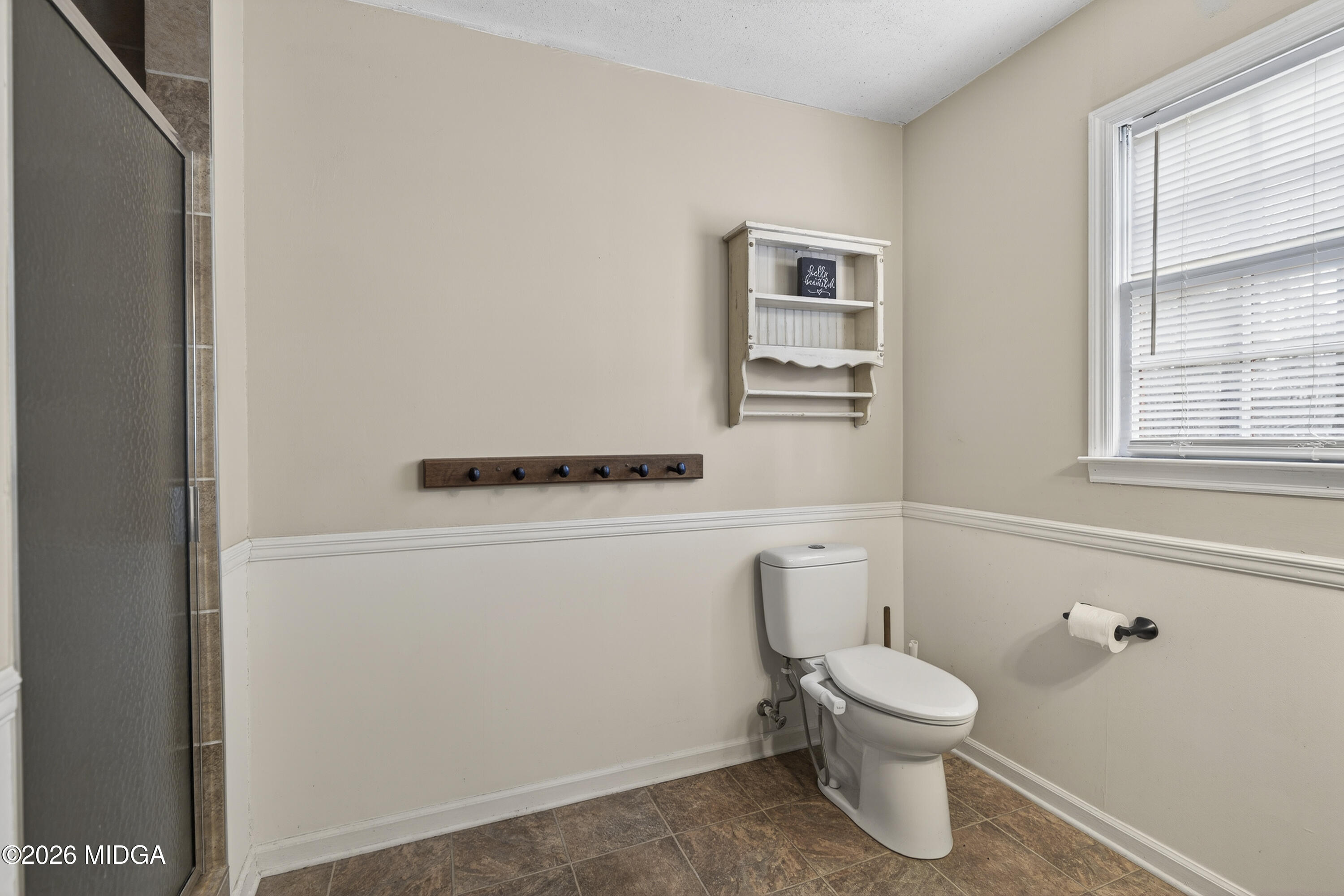 337 Highway 18 Gray, GA 31032 - Photo 42 of 50 a white toilet sitting next to a bathroom sink