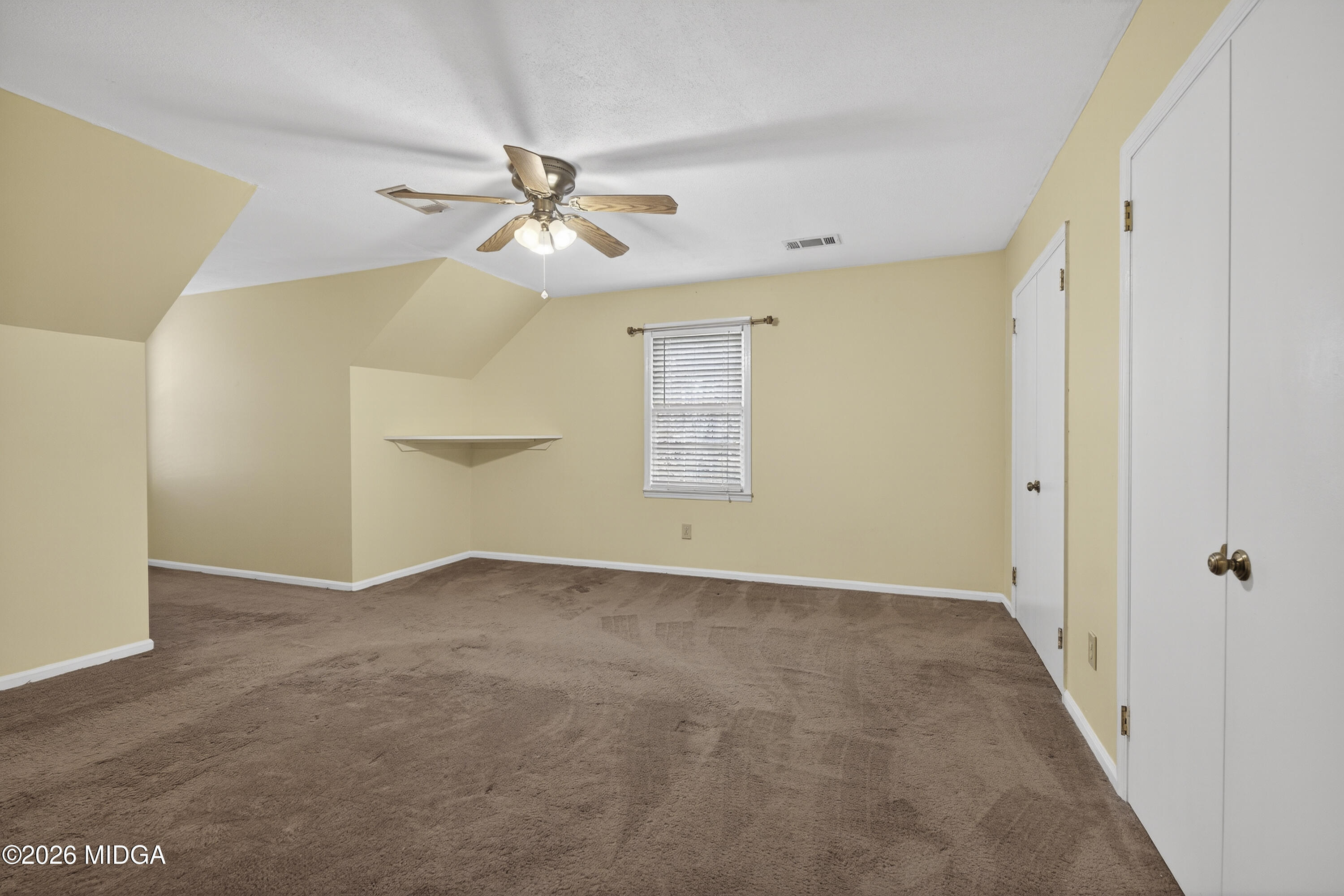337 Highway 18 Gray, GA 31032 - Photo 43 of 50 a view of an empty room with a ceiling fan