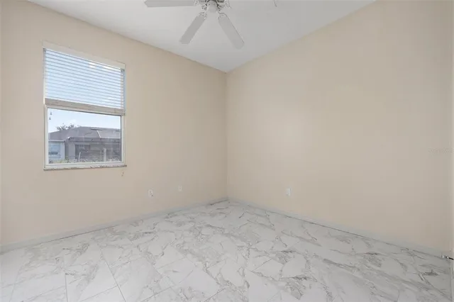 an empty room with a empty space and windows