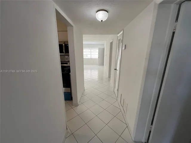 a bathroom with a toilet sink and shower