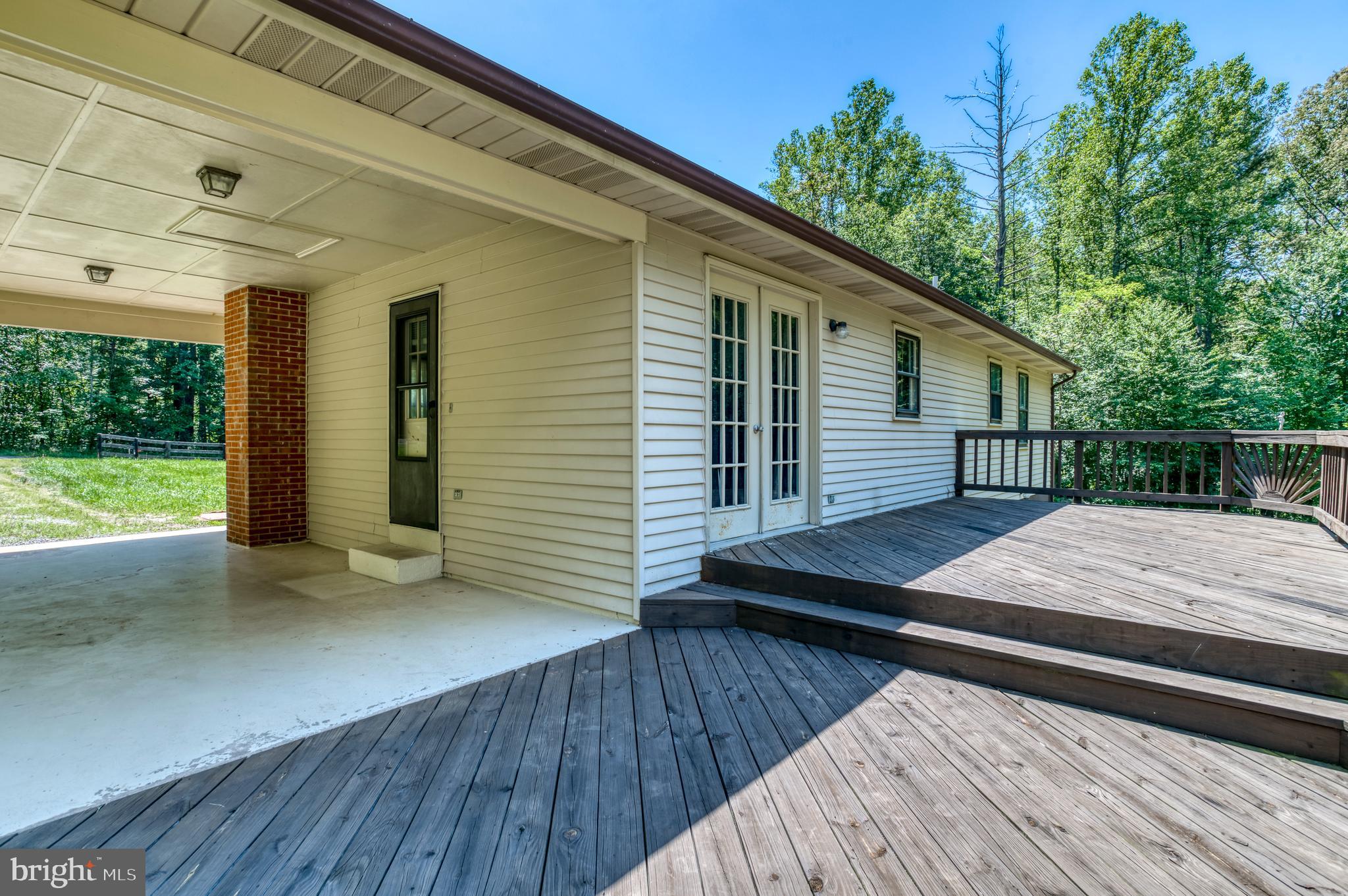 803 Weaver Hollow Road Banco, VA 22711 - Photo 23 of 67 a view of a deck with wooden floor and fence next to a yard