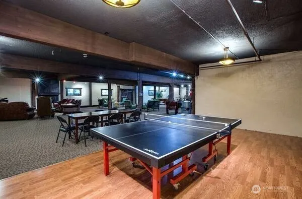 a room with furniture and pool table