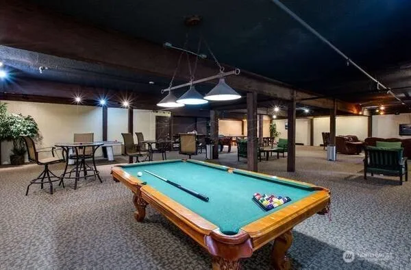 a media room with lots of chairs and a projector