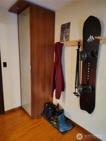 a room with closet and wooden floor
