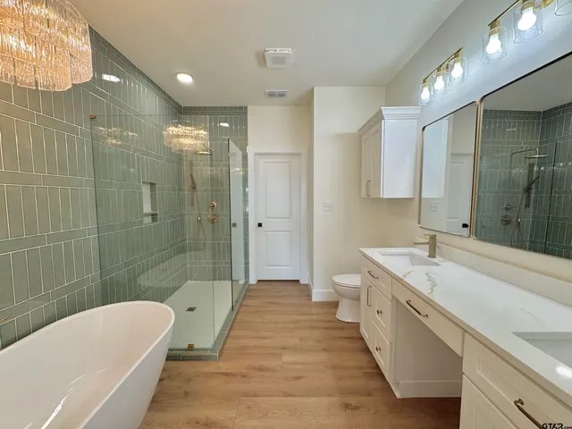 a bathroom with a shower and a sink