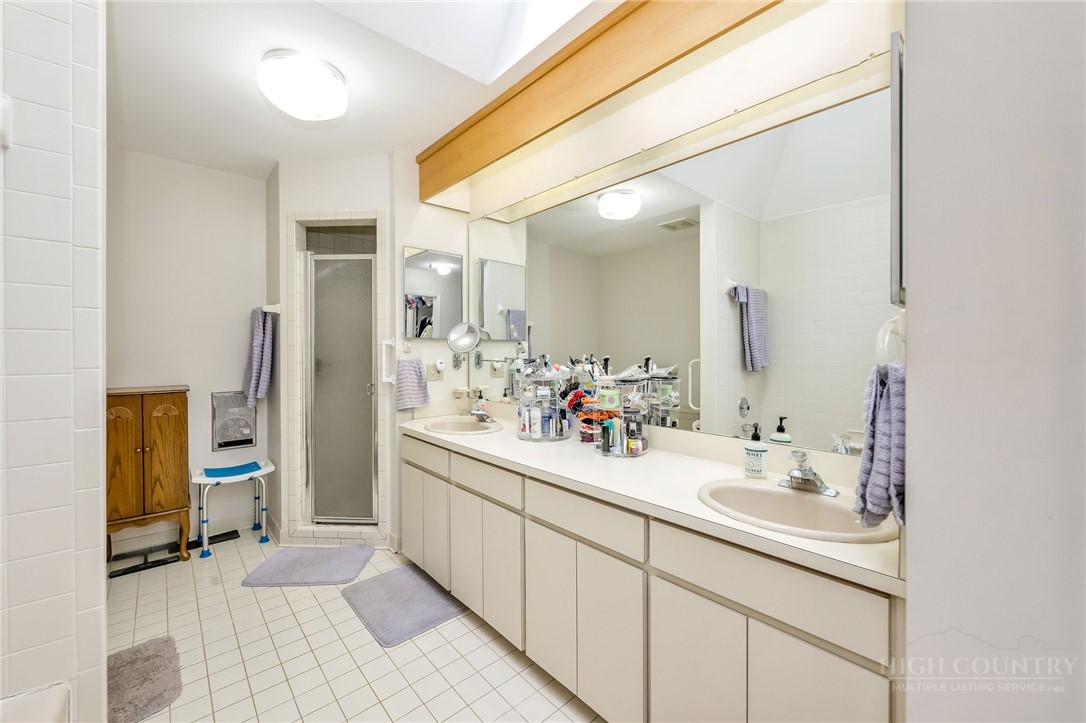939 Don Bare Road Jefferson, NC 28640 - Photo 17 of 49 a bathroom with a sink and a mirror