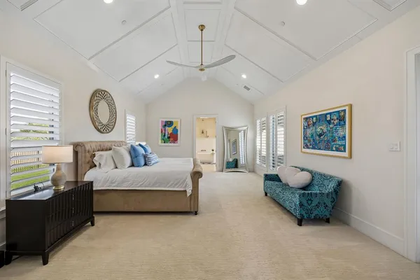 a spacious bathroom with a double vanity sink mirror and bathtub