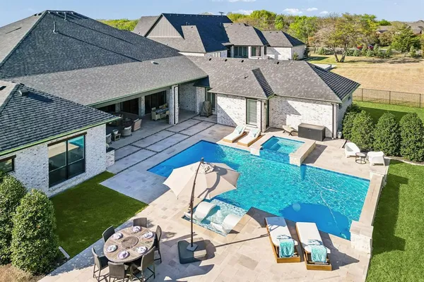 an aerial view of a house having yard