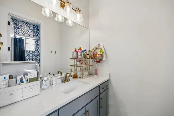 a bedroom with furniture and a window