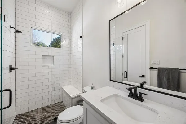 a bed room with a bed and a window