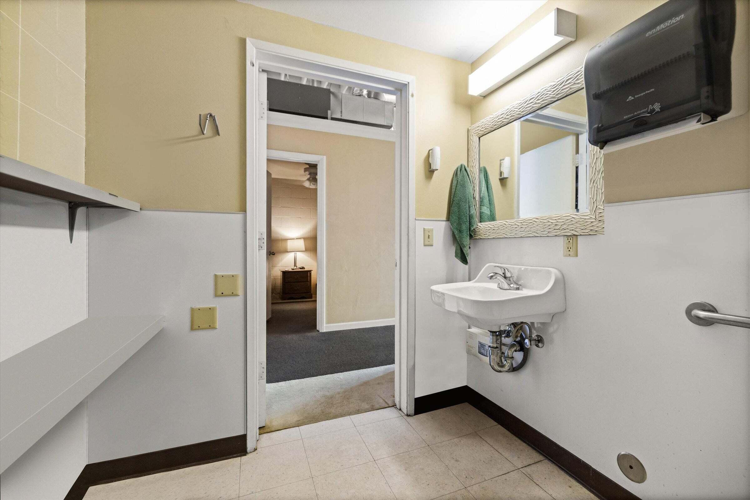 4237 Carpinteria Avenue, Unit B Carpinteria, CA 93013 - Photo 9 of 16 a bathroom with a sink a mirror and bathtub