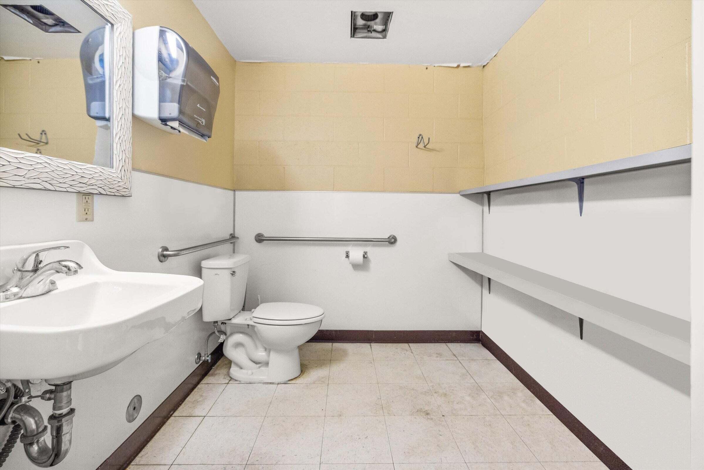 4237 Carpinteria Avenue, Unit B Carpinteria, CA 93013 - Photo 10 of 16 a bathroom with a sink mirror and toilet