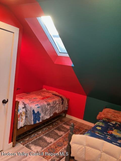 61 Cottekill Road Rosendale, NY 12419 - Photo 21 of 32 a view of a bedroom with bed and wooden floor