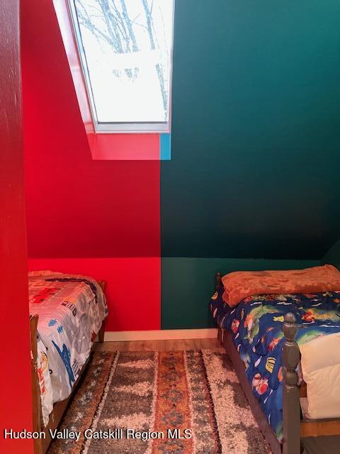 61 Cottekill Road Rosendale, NY 12419 - Photo 22 of 32 a bedroom with a bed and a book shelf