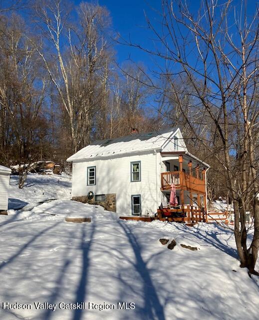 61 Cottekill Road Rosendale, NY 12419 - Photo 32 of 32 a view of a white house with a yard covered in snow