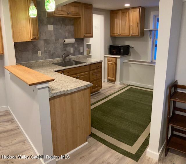 61 Cottekill Road Rosendale, NY 12419 - Photo 5 of 32 a kitchen with a sink stove and cabinets