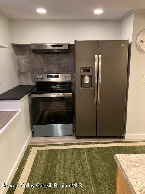 61 Cottekill Road Rosendale, NY 12419 - Photo 8 of 32 a kitchen with stainless steel appliances granite countertop a refrigerator and a stove