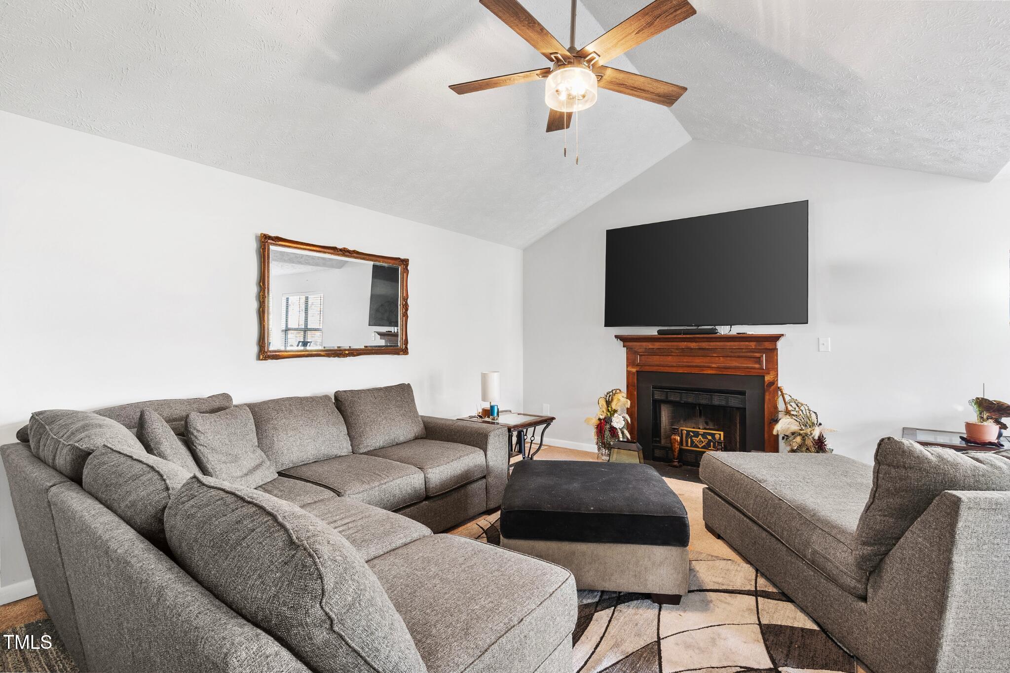 508 Duncan Road Spring Lake, NC 28390 - Photo 6 of 20 a living room with furniture and a flat screen tv