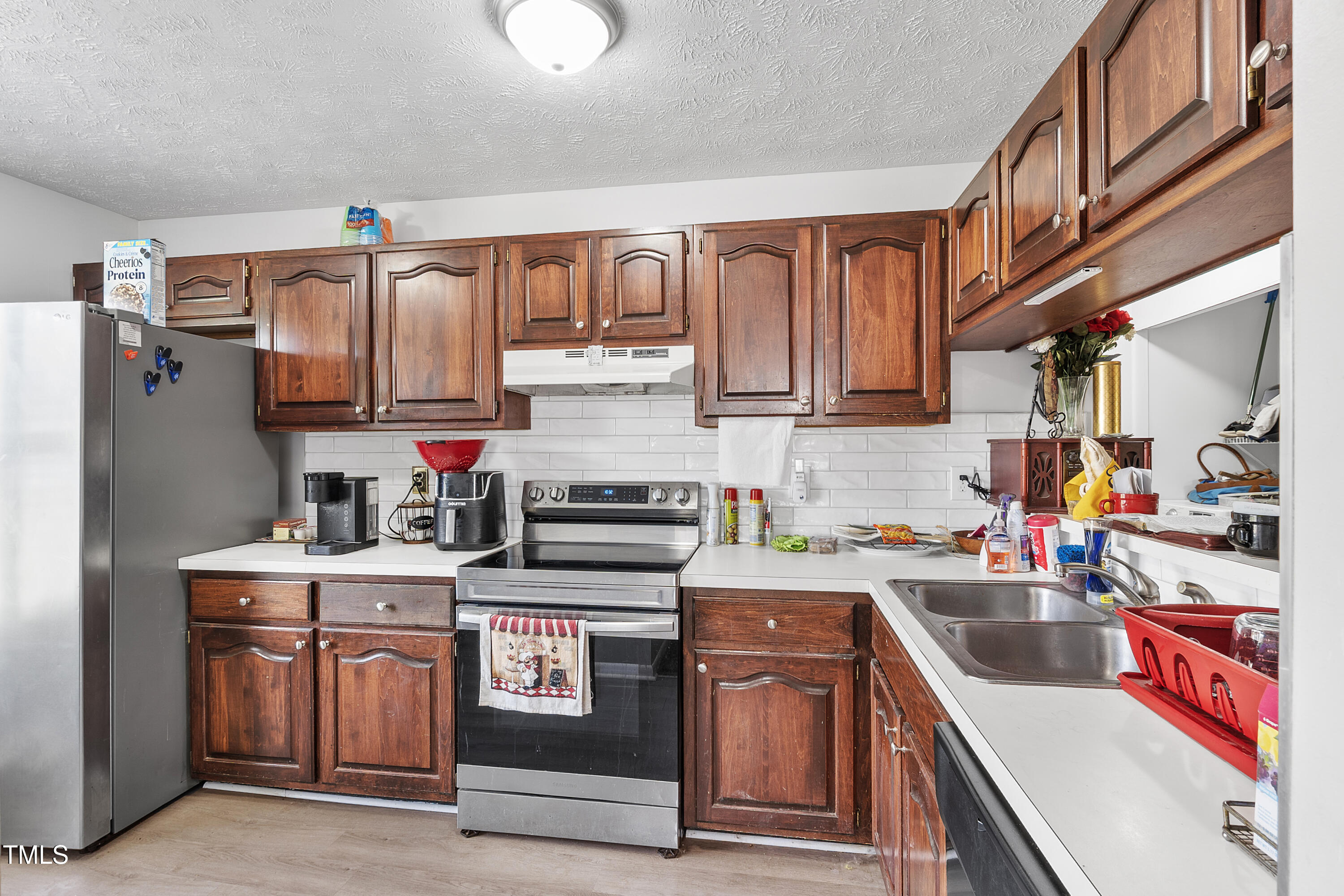 508 Duncan Road Spring Lake, NC 28390 - Photo 8 of 20 a kitchen with stainless steel appliances granite countertop a stove and a sink
