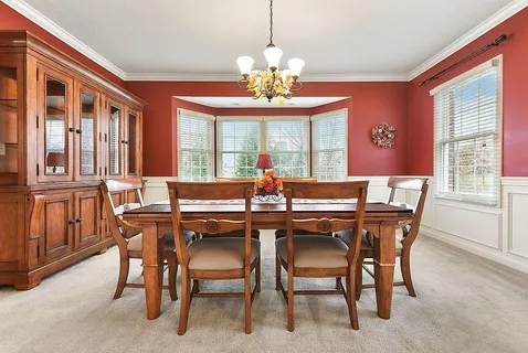a view of a dining room with furniture window and outside view