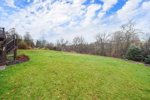 a view of a deck with a yard