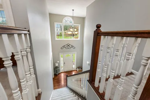 a view of a balcony with wooden floor and staircase