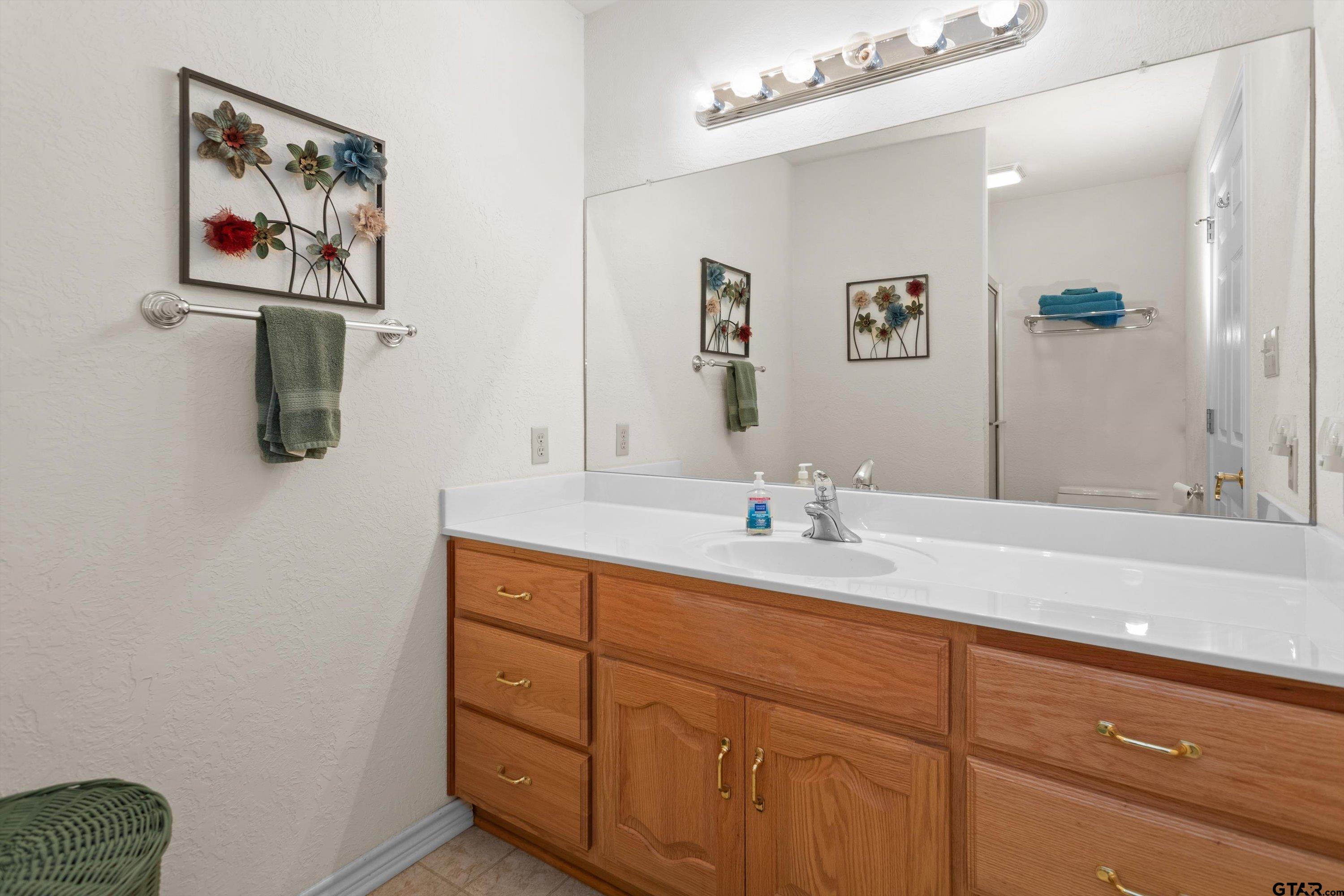 386 Dailey Road Crockett, TX 75835 - Photo 17 of 28 a bathroom with a sink a vanity and a mirror
