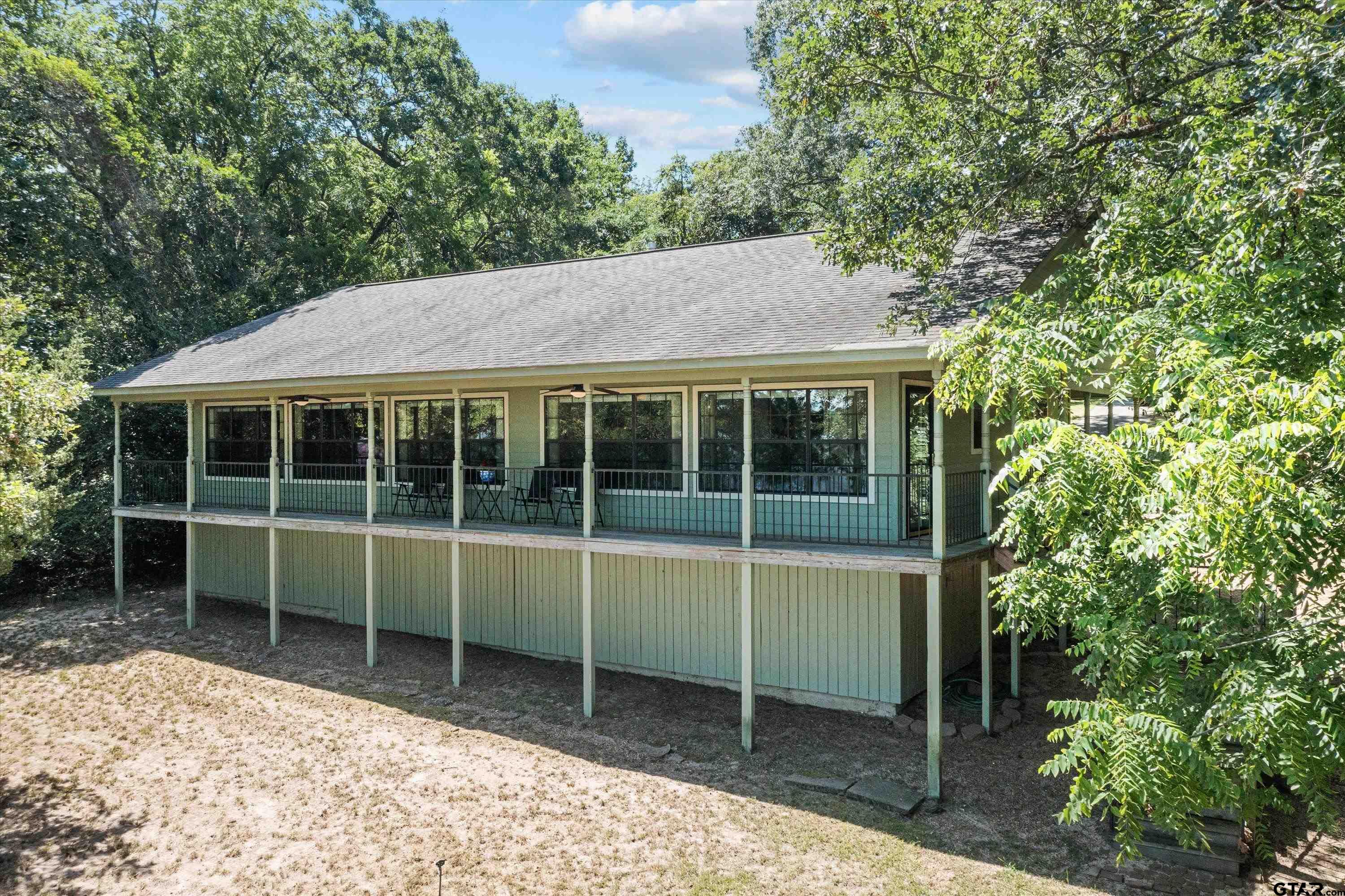 386 Dailey Road Crockett, TX 75835 - Photo 22 of 28 a view of house with a large window and potted plants