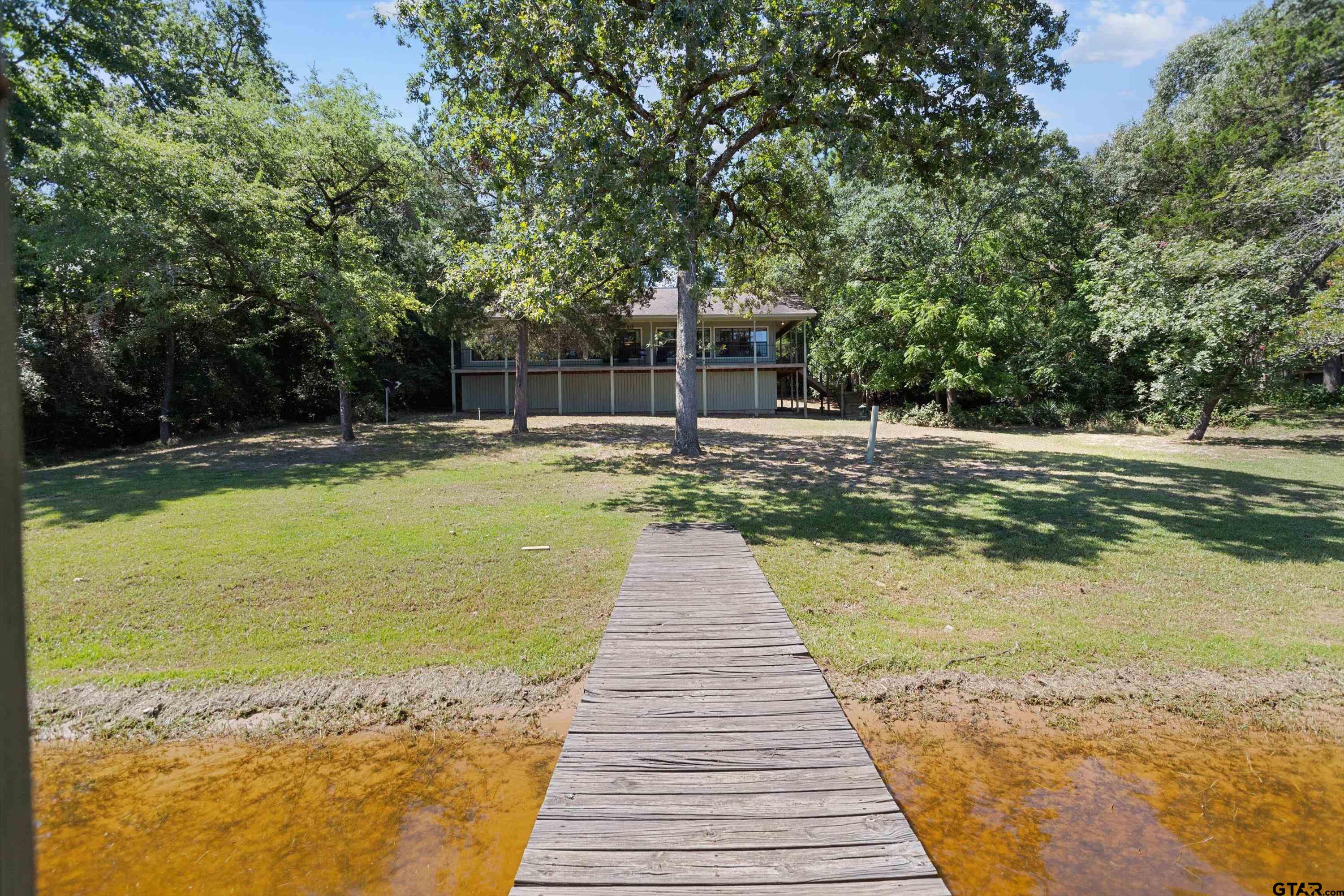 386 Dailey Road Crockett, TX 75835 - Photo 25 of 28 a view of a swimming pool with a yard
