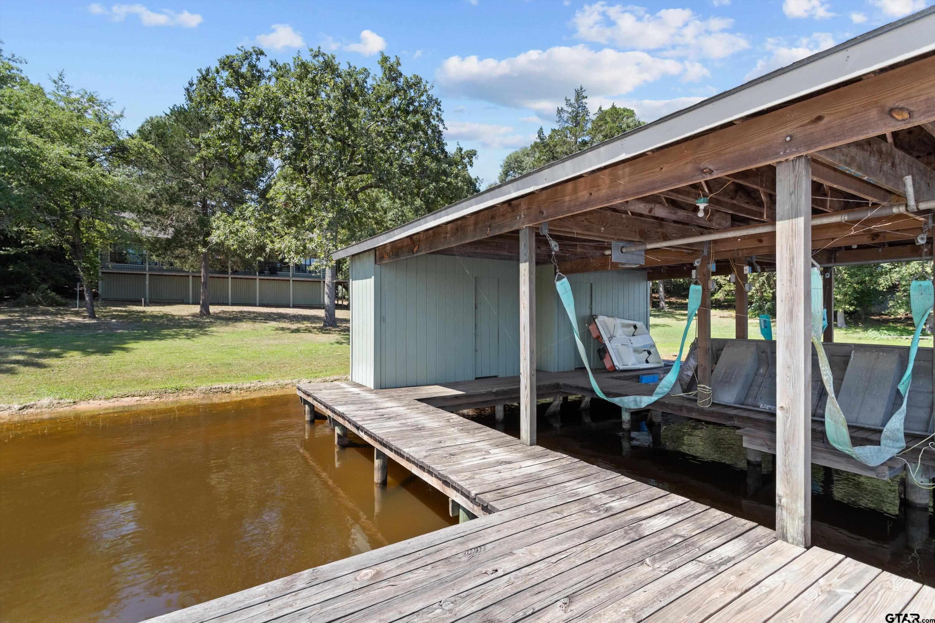 386 Dailey Road Crockett, TX 75835 - Photo 26 of 28 a view of a backyard with sitting area