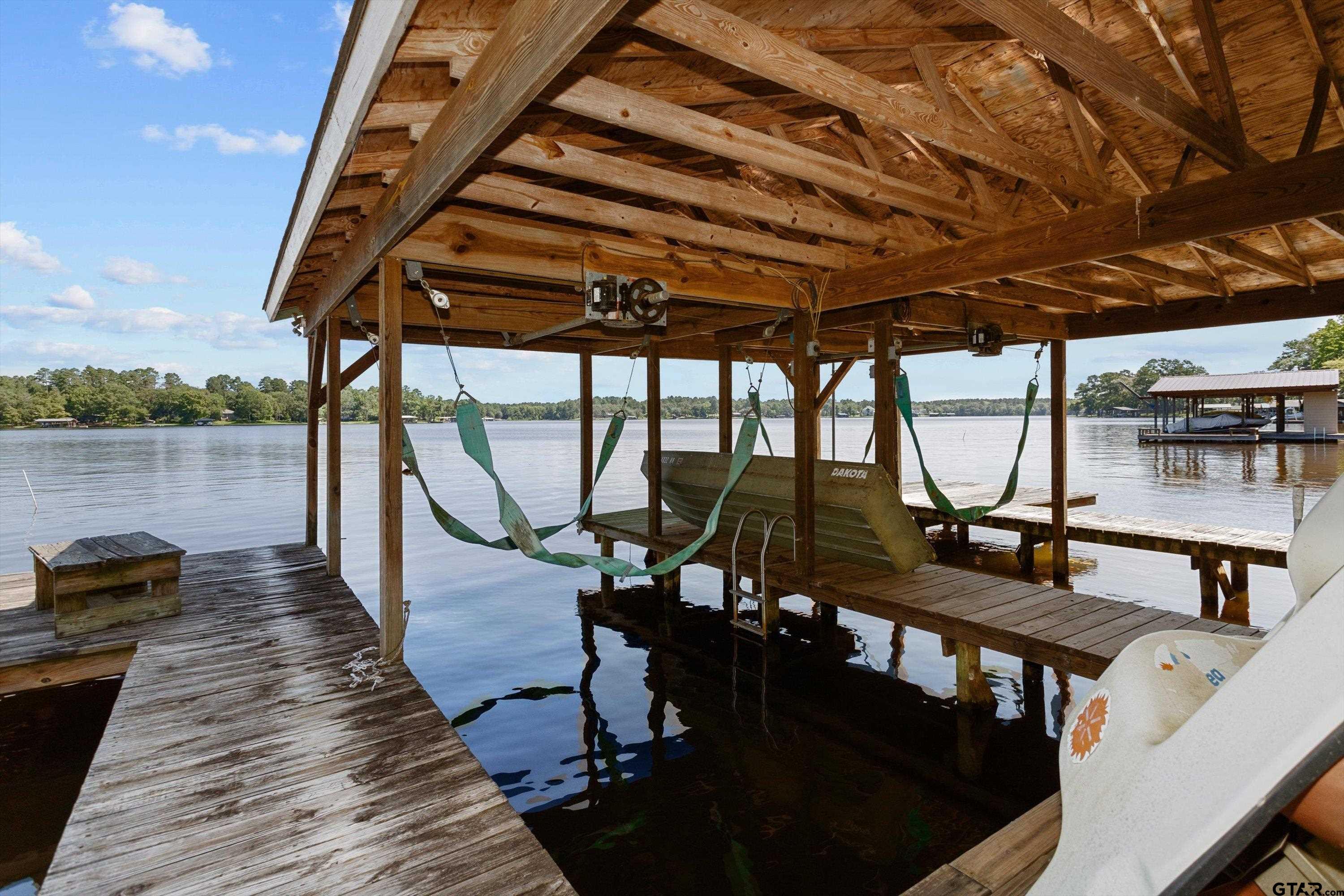 386 Dailey Road Crockett, TX 75835 - Photo 27 of 28 a view of a balcony with chairs and wooden floor